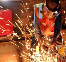 Worker welding for the Electrification Project