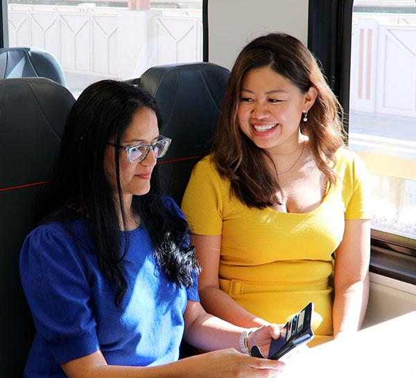 Two people sitting in new EMU