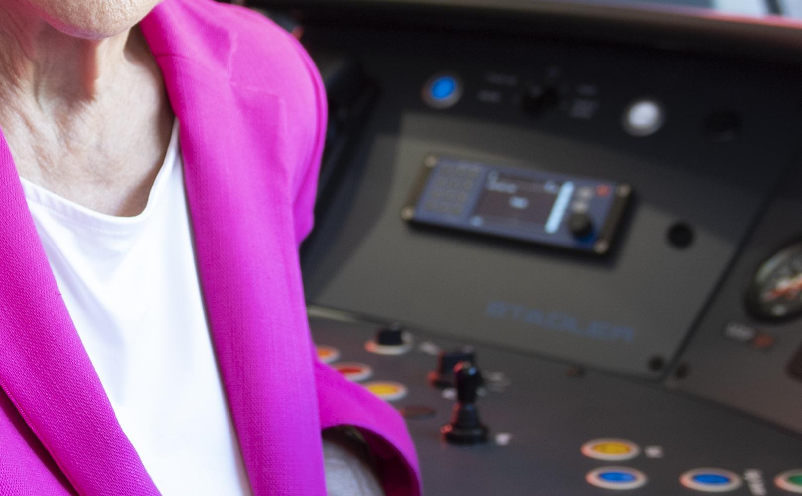 Congressmember Anna Eshoo in the cab of an electric train