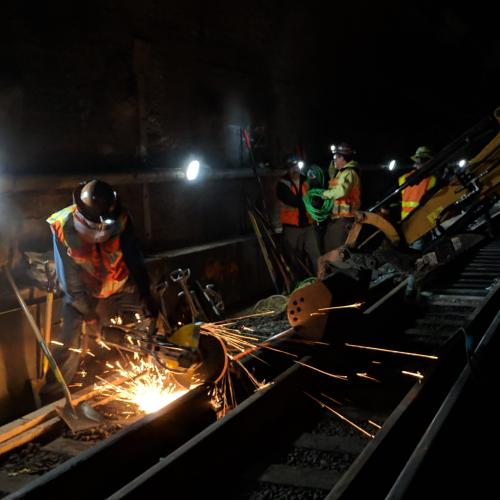 Caltrain construction crew works on the rails in the SF Tunnels