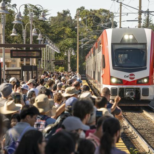 Crowd watches electric train arrive at Palo Alto Station