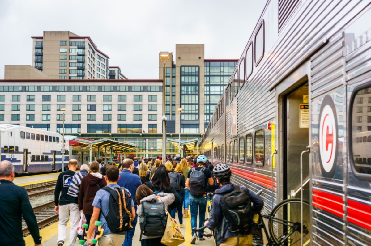 Crowd of people exiting train car